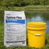 Cutrine Plus Granular Algaecide 30 lb bag next to a 5 gallon bucket by a pond