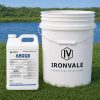 Alligare Argos Algaecide and Herbicide 2.5 gallon beside a 5-gallon bucket and graduated measuring cup for size reference