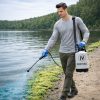 Technician applying Cutrine Plus liquid algaecide to shoreline algae with an Ironvale pump sprayer.