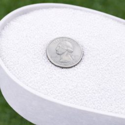 White granules in a scoop for size reference macro 1 to 5 mm