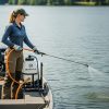 Female technician applies liquid treatments to a lake with a 55 gallon boat mount Ironvale sprayer.