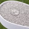 Gray 5/8ths mesh granules in scoop