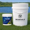 Greenclean Granular 20 lb beside a 5-gallon bucket and graduated measuring cup for size reference