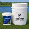 Greenclean Granular 8 lb beside a 5-gallon bucket and graduated measuring cup for size reference