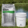 Navigate Granular Herbicide 50 lb bag next to a 5 gallon bucket by a pond