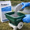 Sculpin G granules being poured from the bag into an Ironvale spreader hopper